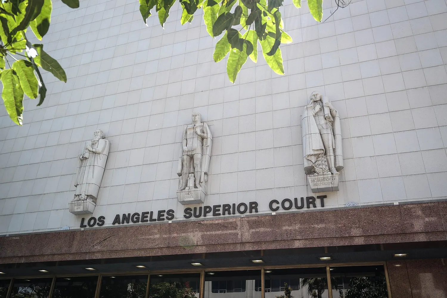 The stone facade of the Stanley Mosk Courthouse in downtown Los Angeles with the words Los Angeles Superior Court above the entrance.